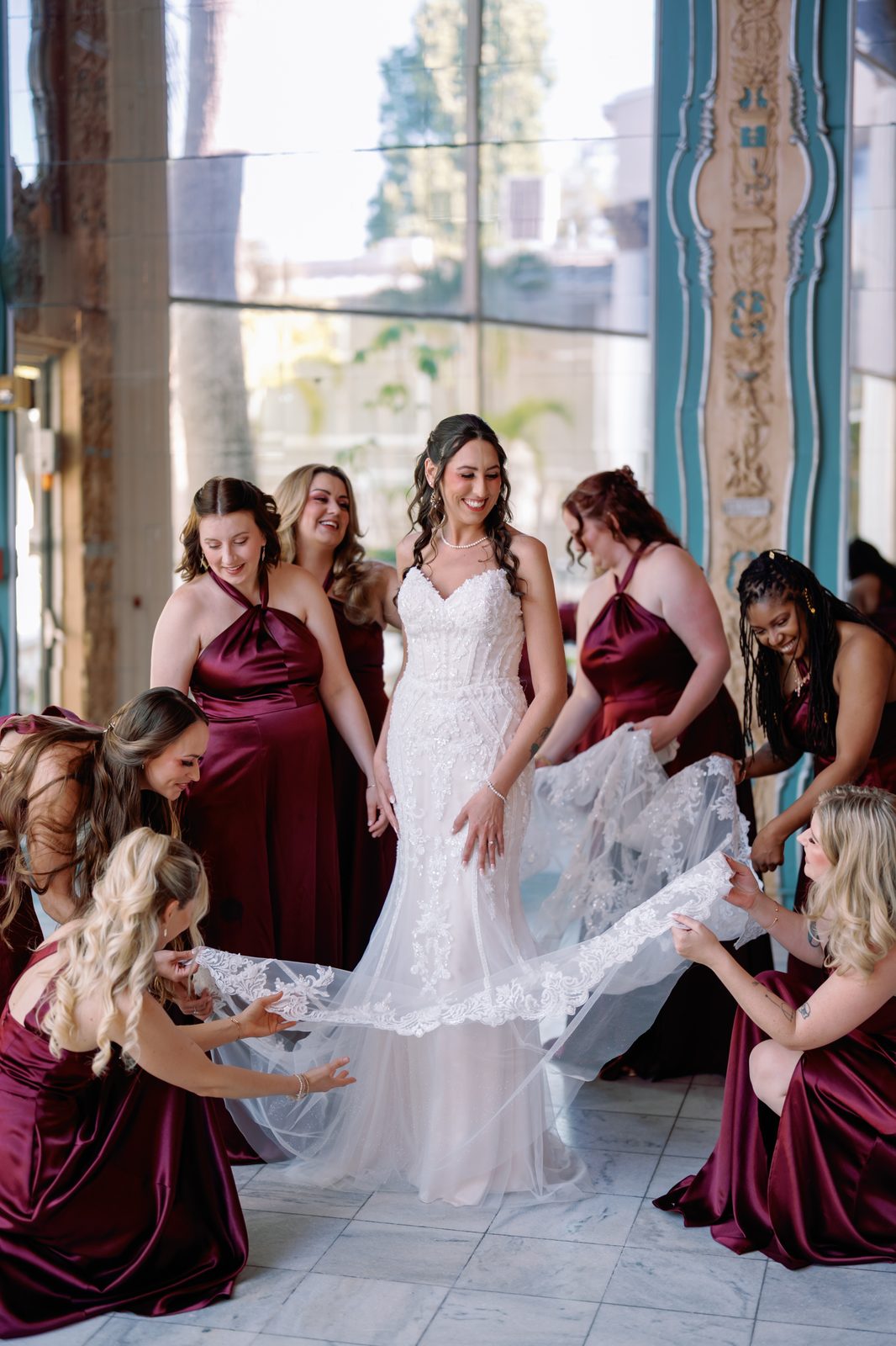 Bridesmaids getting ready together before the ceremony